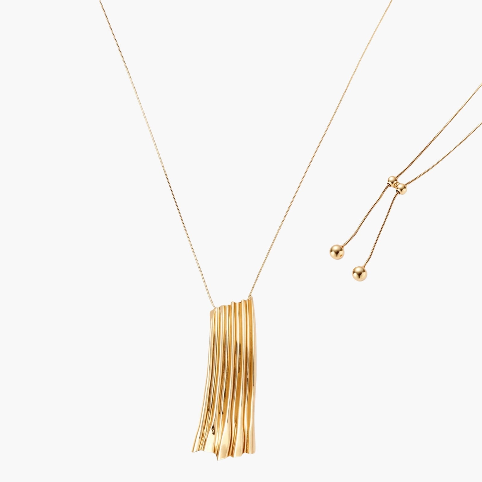 Modern adjustable necklace featuring geometric ribbed pendant with vertical lines in gold and silver finish options.