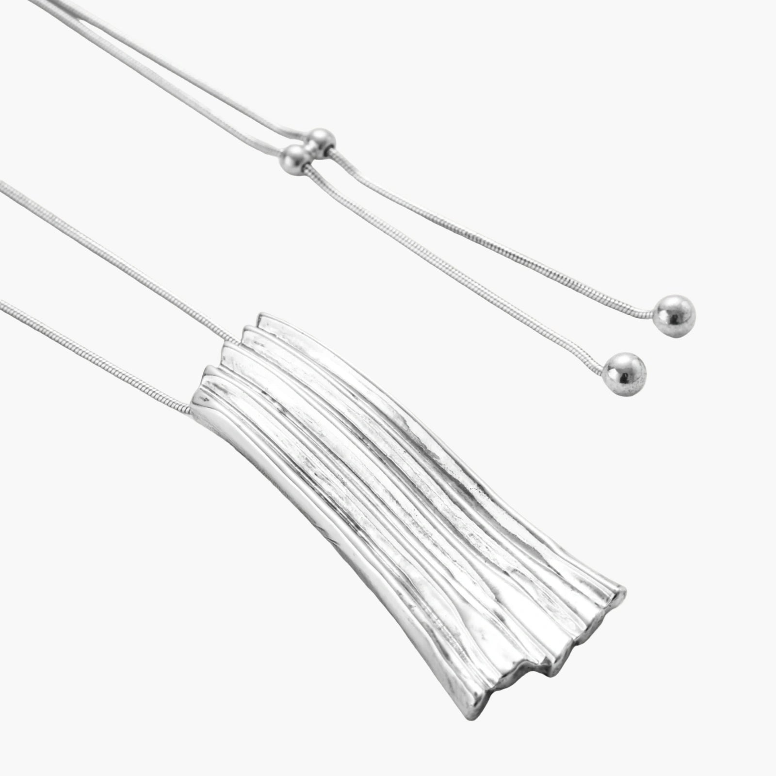 Modern adjustable necklace featuring geometric ribbed pendant with vertical lines in gold and silver finish options.