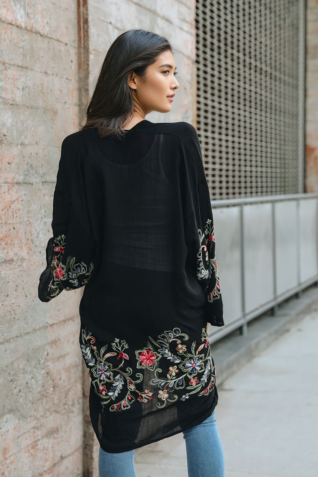 Comfortable long floral black cardigan with breathable materials.